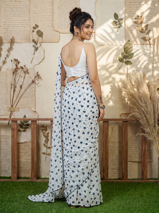 Saranya White Ethnic Motif Georgette Saree with Embroidered Border & White Blouse Piece