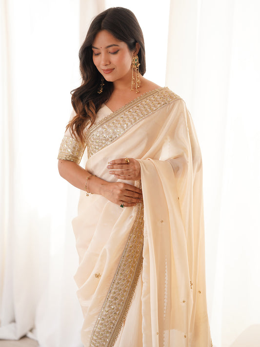 Cream Satin Silk Saree with Intricate Sequins and Gota Embroidered Border