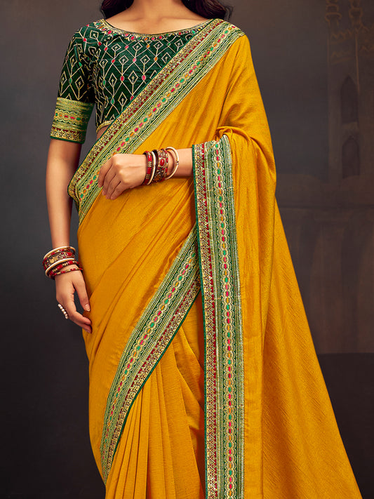 Mustard Yellow Silk Saree with Green Embroidered Blouse
