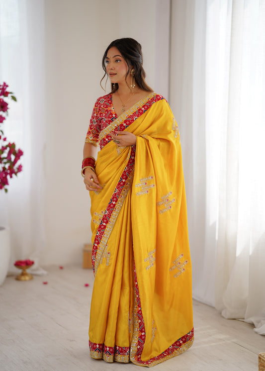 Nilam Yellow Silk Saree with Patola Border & Embroidery