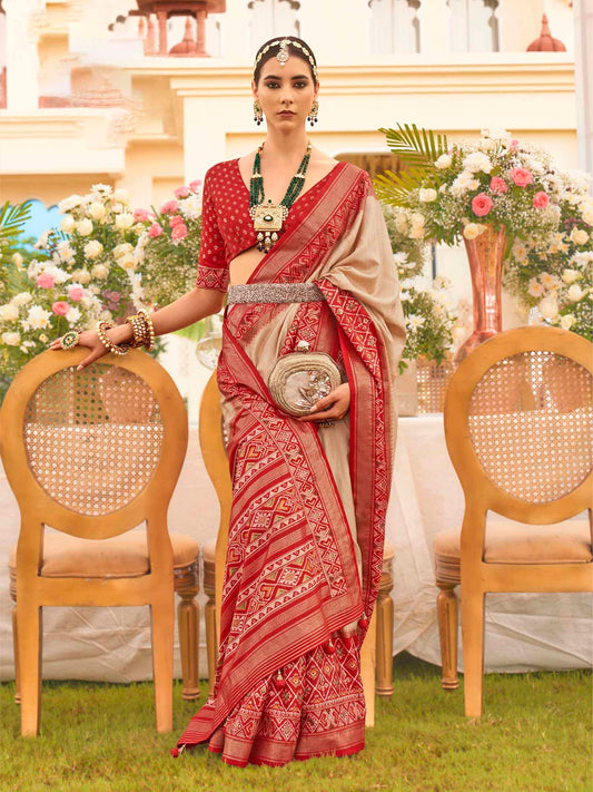 Beige Zari Woven Silk Blend Saree with Red Patola Borders