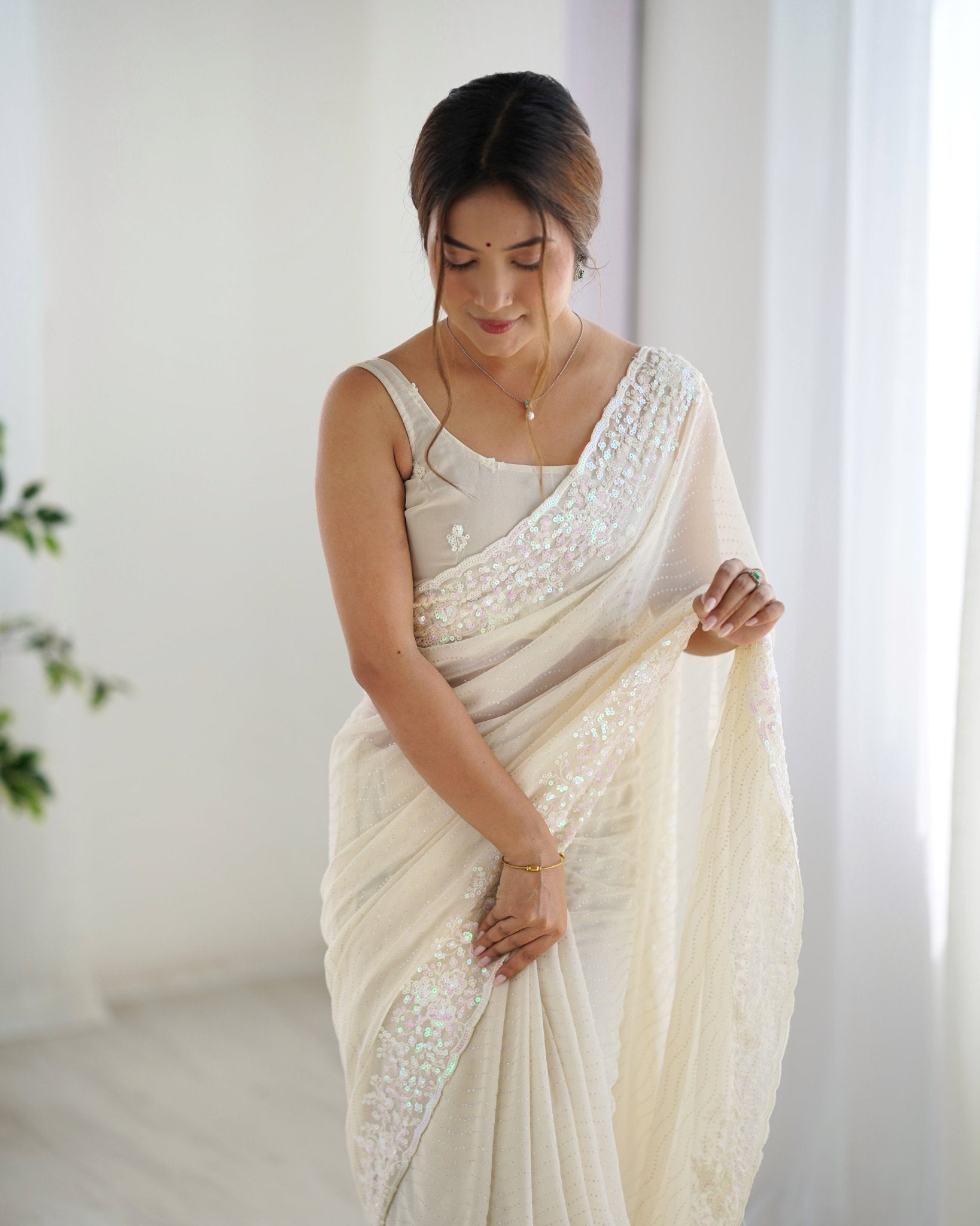 Ivory Sequin Georgette Saree with Embroidered Border - Ressa