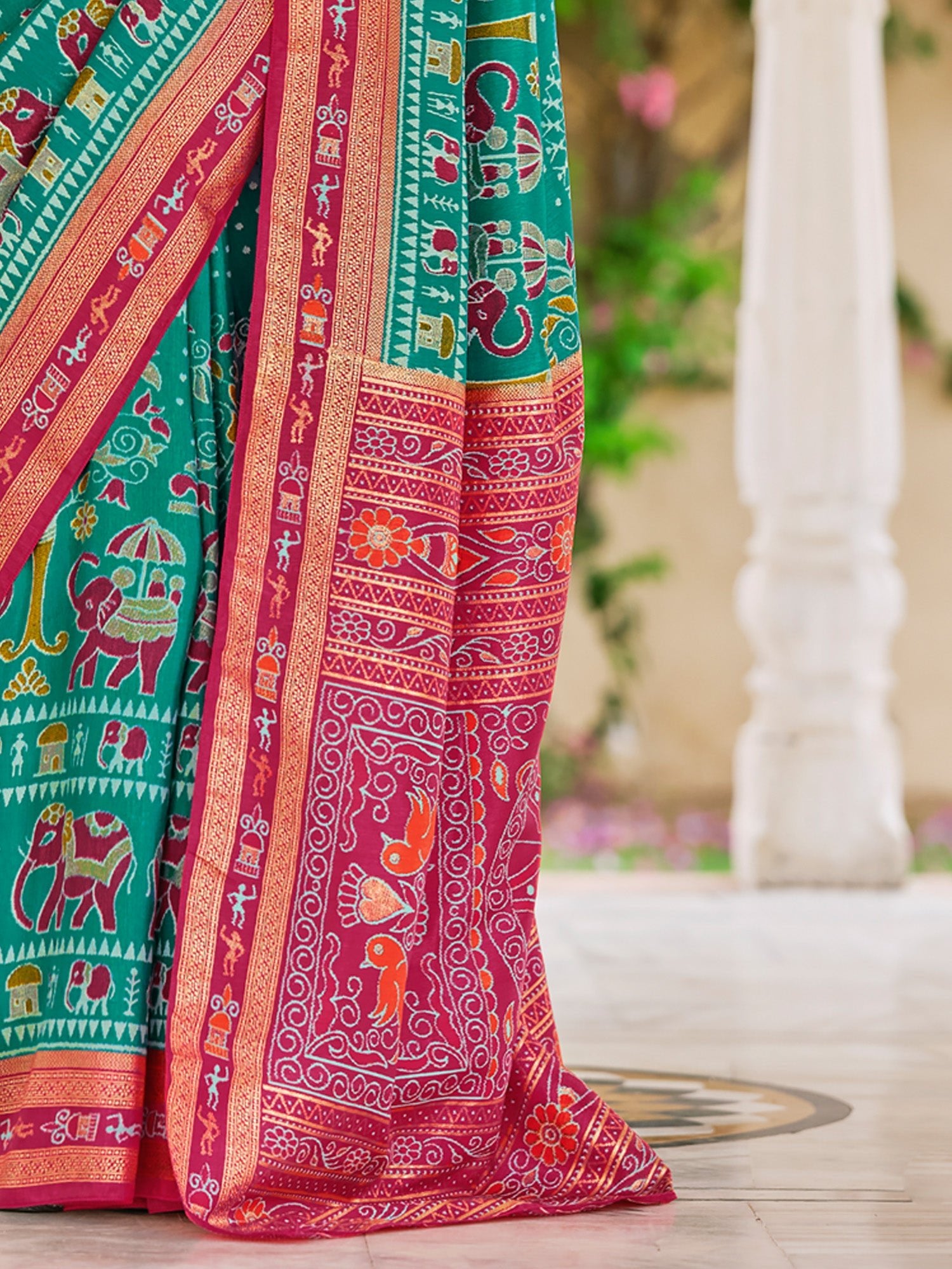 Teal Green Patola Silk Ikat Printed Contrast Pink Border saree - Ressa